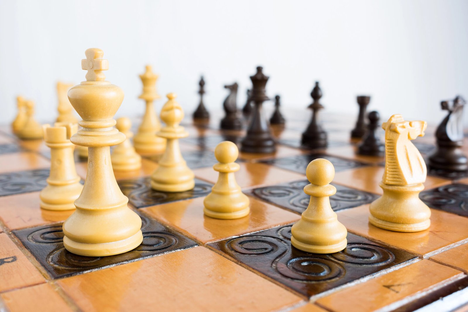 Chess Club 1 Chess pieces on a wooden board